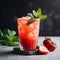 Strawberry mojito. Mocktail or coctail with strawberries and mint leafs. The refreshing red drink on dark gray background, close