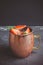 Strawberry moscow mule on thr rustic background