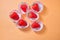 Strawberry paper tray orange background