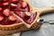 Strawberry pie with fresh berries. Cake shovel with piece of pie on blurred background. Sweet summer dessert