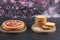 Strawberry pie and sultana pie slices on wooden boards