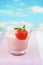 Strawberry pink milk shake, summer sky background