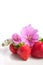 Strawberry on a plate decorated with malva flowers