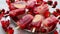 Strawberry raspberry apple and red currant ice cream popsicles in metal tray with ice cubes