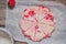 Strawberry scones dough cutted into segments on a parchment pape