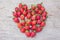 Strawberry shape heart on dry wood