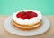 Strawberry short cake on a plate green background