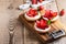 Strawberry shortcake pies on rustic wooden table