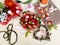 Strawberry  and slices  on white background ,table setting ,flowers in red cup ,and ,branch in heart shape still life