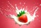 strawberry splashing into cream