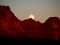 The Strawberry Supermoon Rising over the Superstition Mountains at Sunset