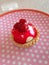 Strawberry tart on pink spotty plate