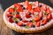 Strawberry tart with pink whipped cream, mint and blueberries. h