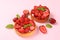 Strawberry tarts on pink background, close up