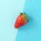 Strawberry on two tone blue background