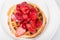 Strawberry waffle with maple syrup