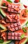 Strawberry watermelon ice cream popsicles with mint over steel tray background