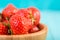 Strawberry Wood Bowl On Blue Background