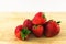 Strawberrys on wood on white background.