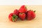 Strawberrys on wood on white background.