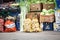 Stray Cat sneaking among food for sale on a stand of a pijaca a green farmers market in the city center of Belgrade, Serbia