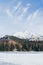 Strbske Pleso, Slovakia - December 2019: view over Patria hotel and High Tatra mountains above frozen lake