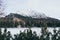 Strbske Pleso, Slovakia - December 2019: view over Patria hotel and High Tatra mountains above frozen lake