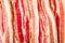 Streaky bacon background close-up