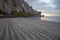 Streaky sand patterns at sunset at Morro Rock on the central coast of California at Morro Bay California USA