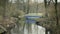 Stream with blue metallic Art Nouveau bridge