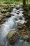 A stream/creek with dreamy flowing waters and rock