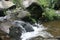 Stream flowing rapidly over rocks Otavalo Ecuador