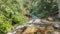 The stream flows along a rocky bed.