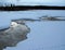 Stream from geyser during winter in Yellowstone National Park in Wyoming USA