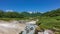 A stream from a hot natural spring flows in the caldera of an extinct volcano.