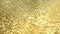 A stream of liquid gold. Yellow background with flowing golden waves. 3D image.