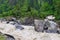 Stream meeting river Bhagirathi among Himalayan Mountains, Uttarakhand, India