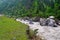 Stream meeting river Bhagirathi among Himalayan Mountains, Uttarakhand, India