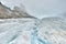 Stream of melted snow on the glacier along the Icefields Parkway between Banff and Jasper in the Canadian Rockies