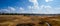 Stream Running Through Rolling Grasslands