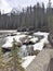 Stream with snow covered rocks - Rocky Mountains, Canada