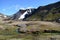 Stream Winding Through a Valley with Steam Rising