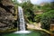 streaming waterfall in national park. small waterfall in Thailand. deep forest brook has green jungle from big tree.The forest