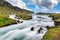 Streams in summer, with green grass and blue skies with beautiful clouds In the countryside in Iceland