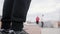 Street acrobatic teenagers - Freerunner Performing flips outdoor - de-focused in front of sneakers