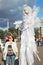 Street actor dressed like an angel poses for photos in Moscow