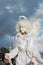 Street actor dressed like an angel poses for photos in Moscow