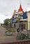 Street in Akureyri centre with blue house, flowerpots and bikes