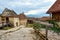 Street of the ancient fortress town. Medieval walled city Rasnov on hill, Romania. Autumn landscape with Medieval fortification