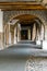 Street with arcades and old columns and old stone houses. Arbucies, Spain